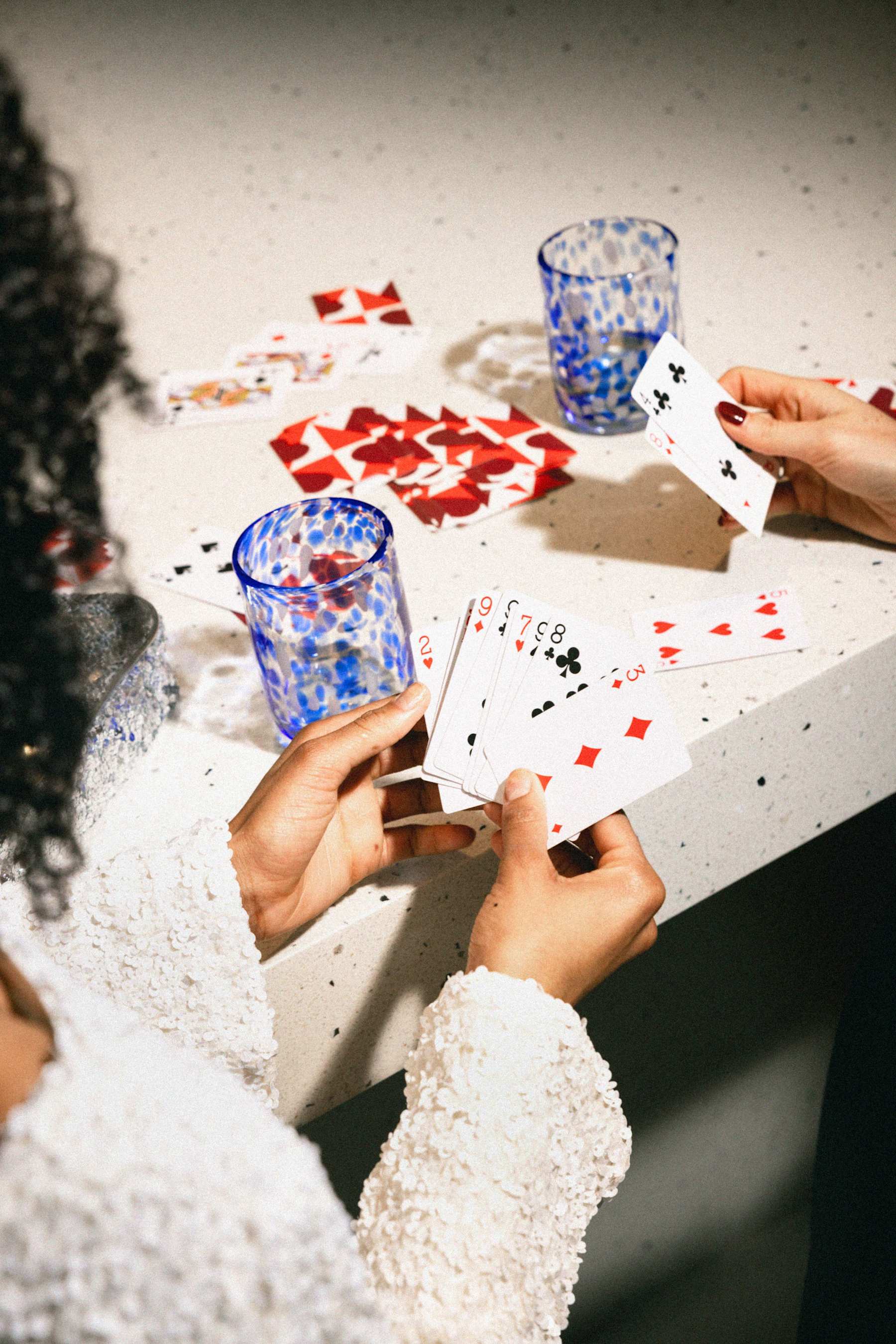 Two residents playing cards in a lounge at Ferry Island