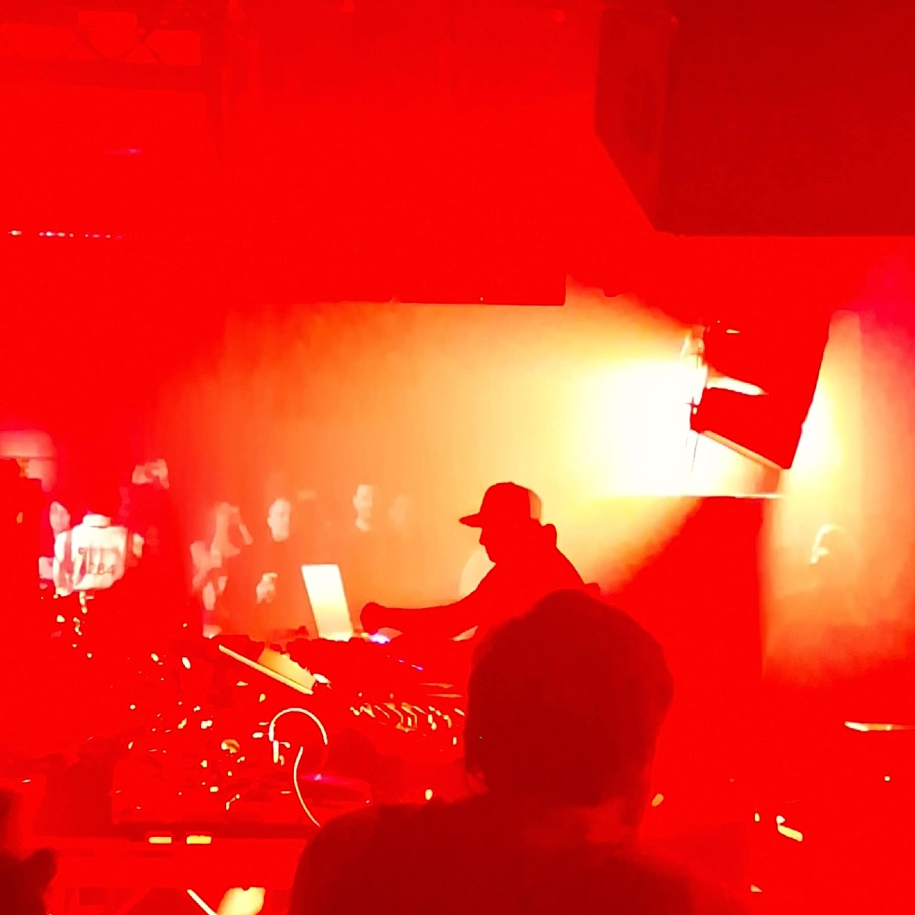 A DJ performing to a crowd at Drumsheds